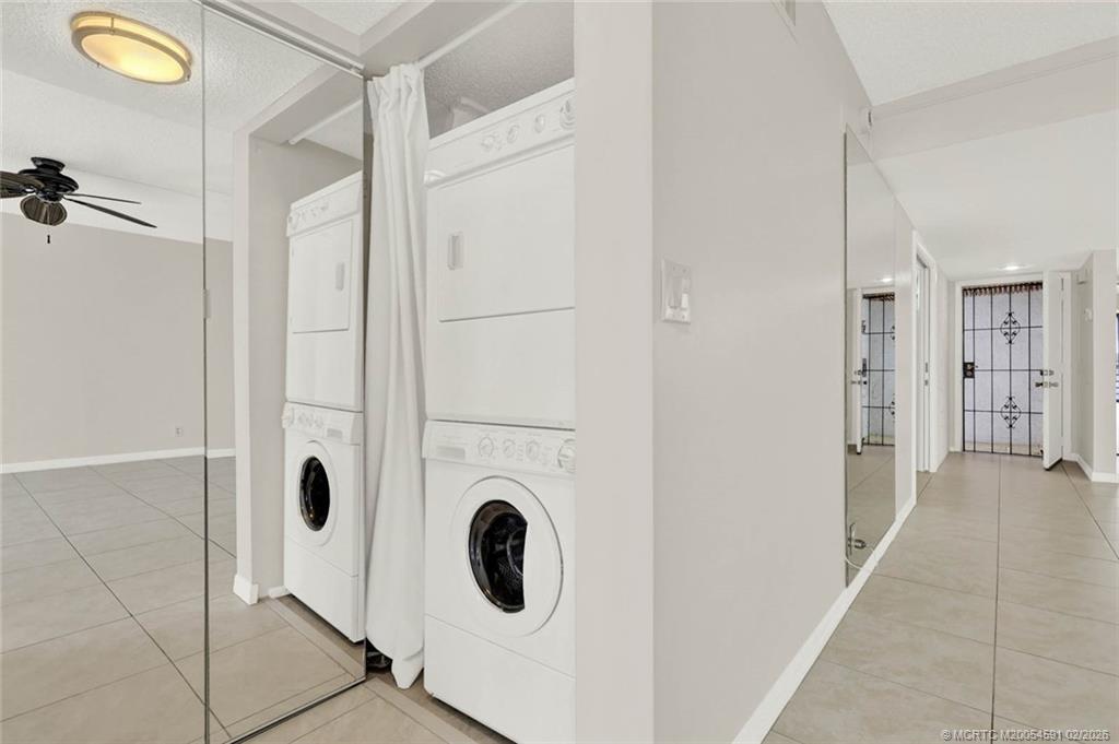 1950 Southwest Palm City Road, Unit 13301 Stuart, FL 34994 - Photo 38 of 58 a view of a storage & utility room with washer and dryer