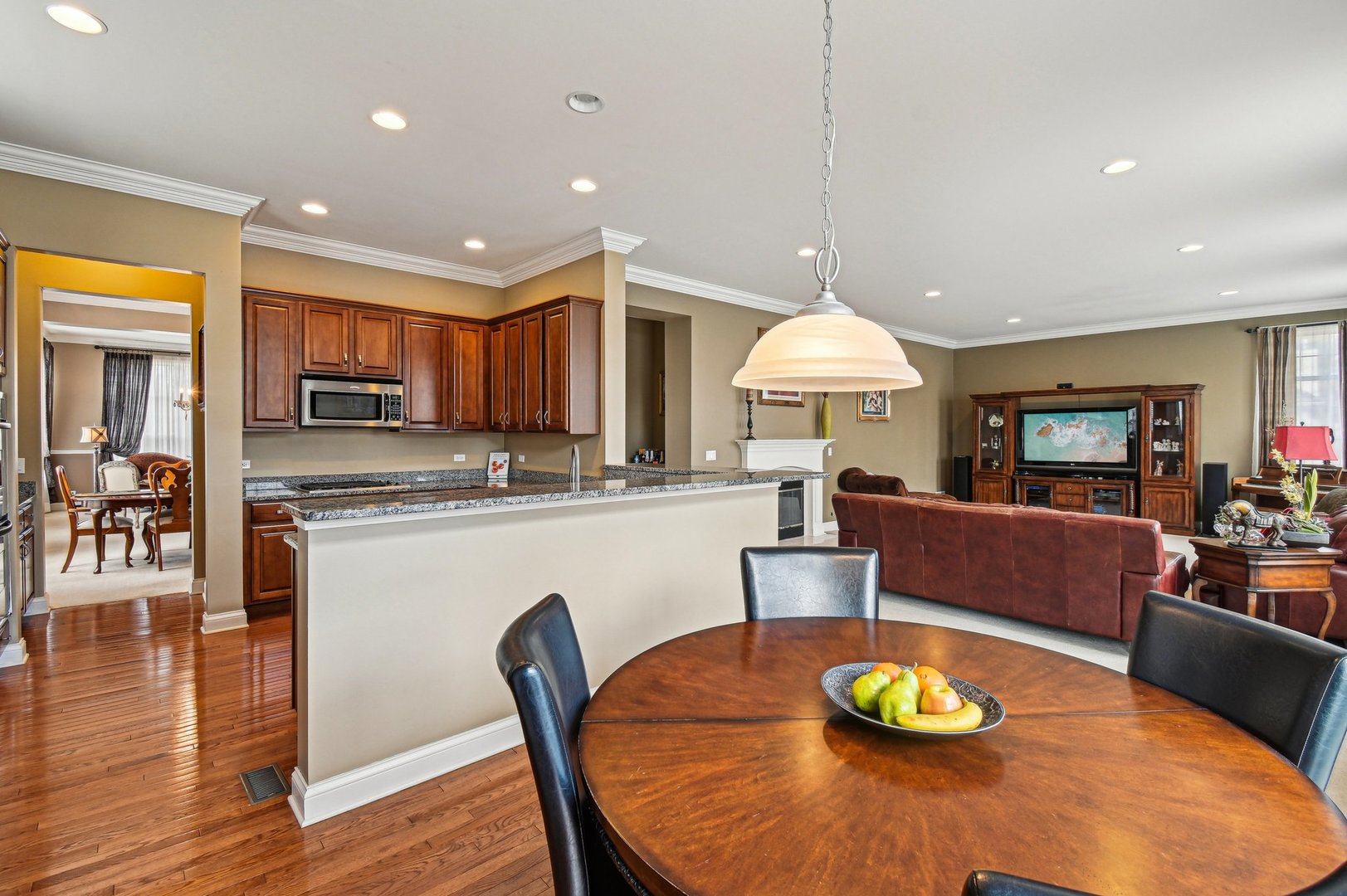 1037 Moray Drive Inverness, IL 60010 - Photo 14 of 50 a view of a dining room with furniture and wooden floor