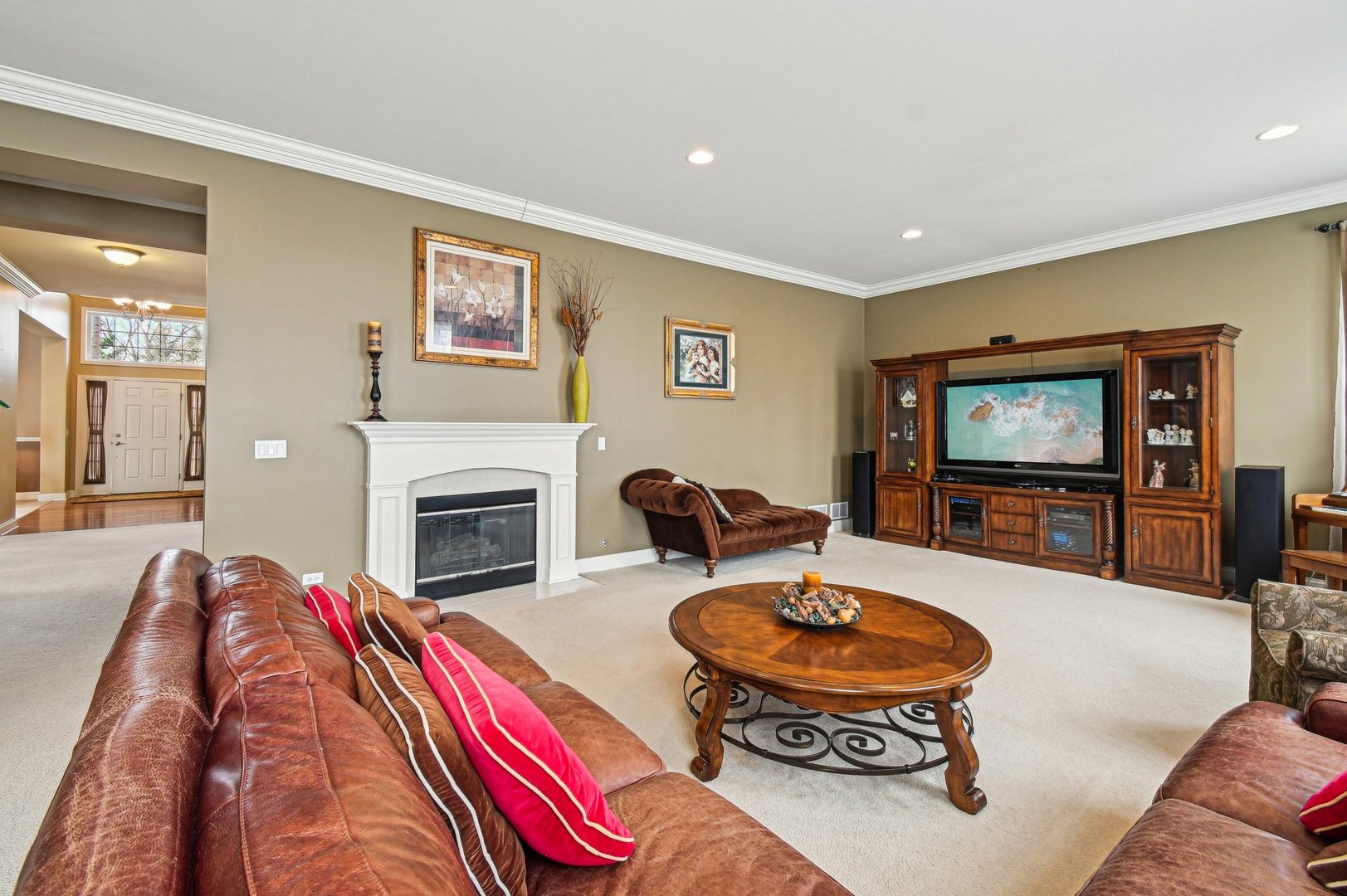 1037 Moray Drive Inverness, IL 60010 - Photo 21 of 50 a living room with furniture a flat screen tv and a fireplace