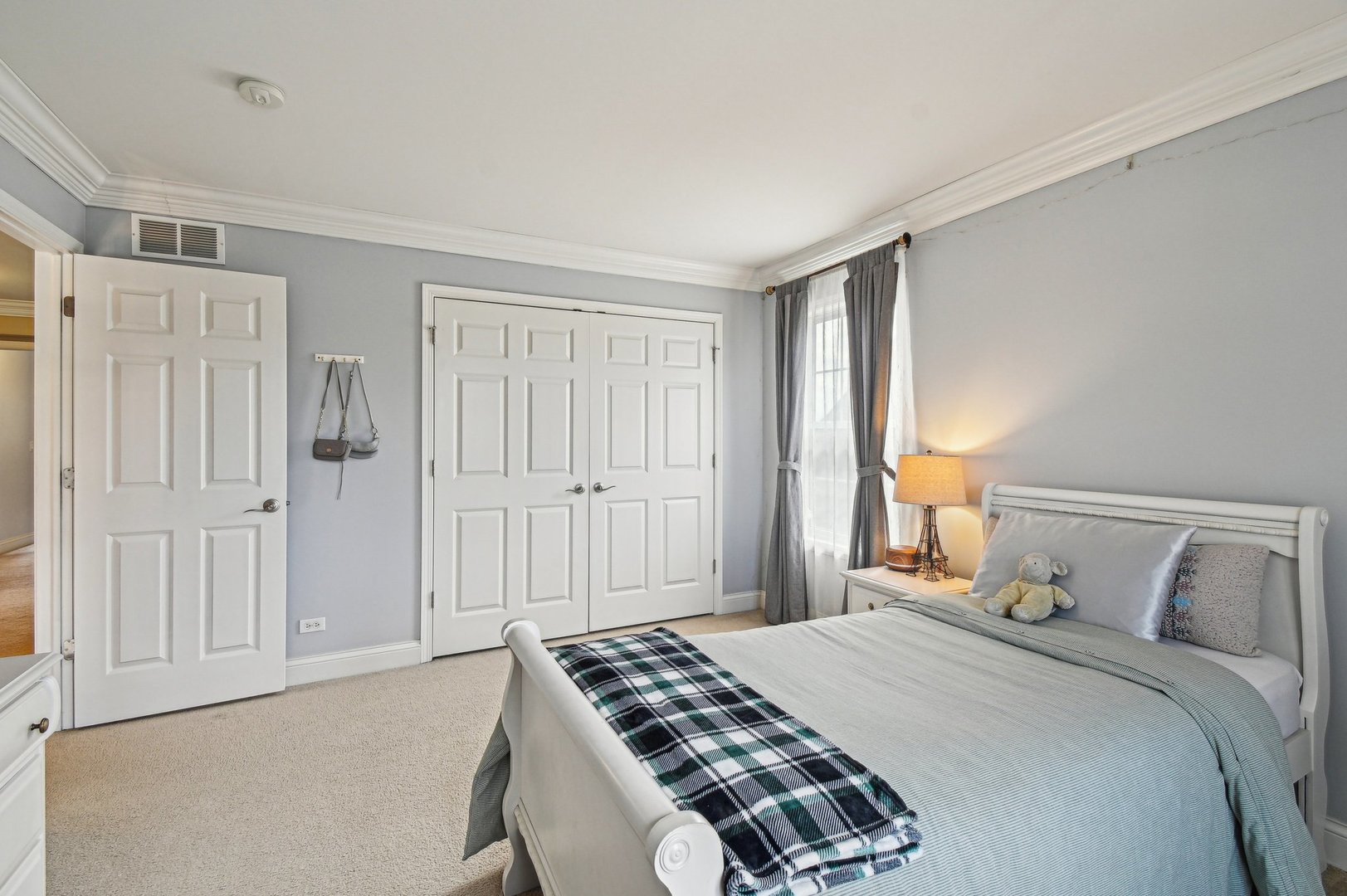 1037 Moray Drive Inverness, IL 60010 - Photo 32 of 50 a bedroom with a bed and a window