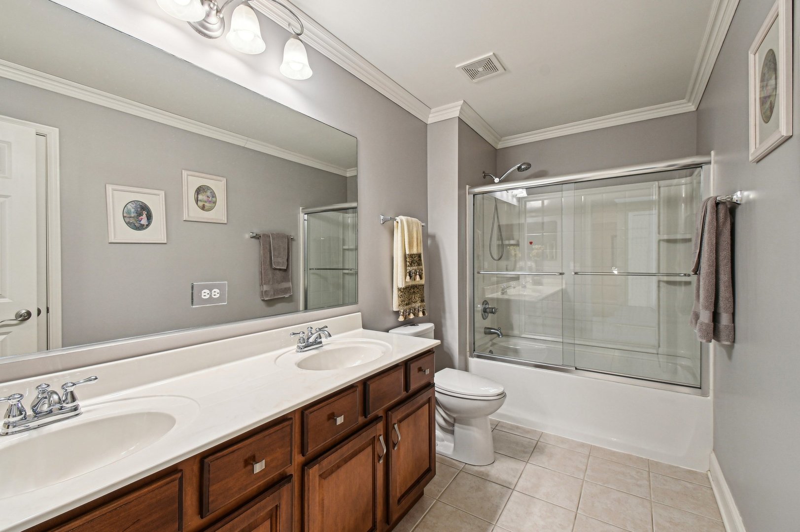 1037 Moray Drive Inverness, IL 60010 - Photo 34 of 50 a bathroom with a double vanity sink mirror toilet and shower