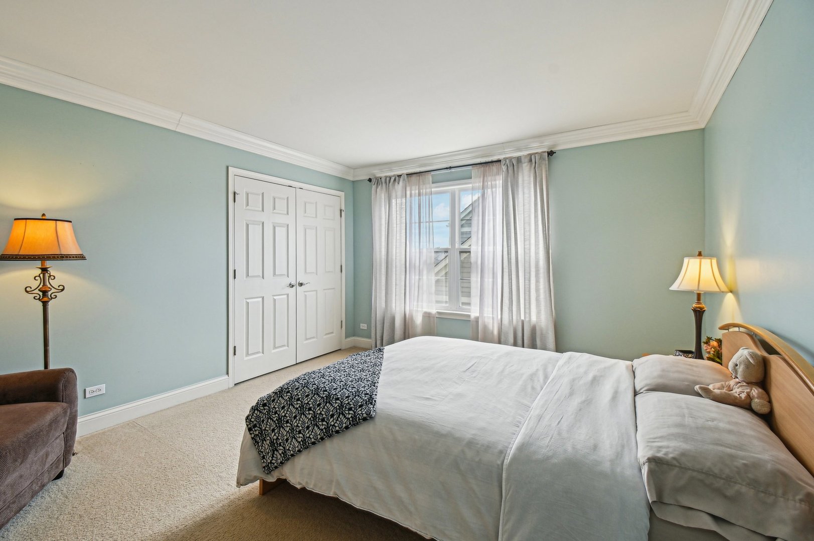 1037 Moray Drive Inverness, IL 60010 - Photo 35 of 50 a bedroom with a bed and a lamp