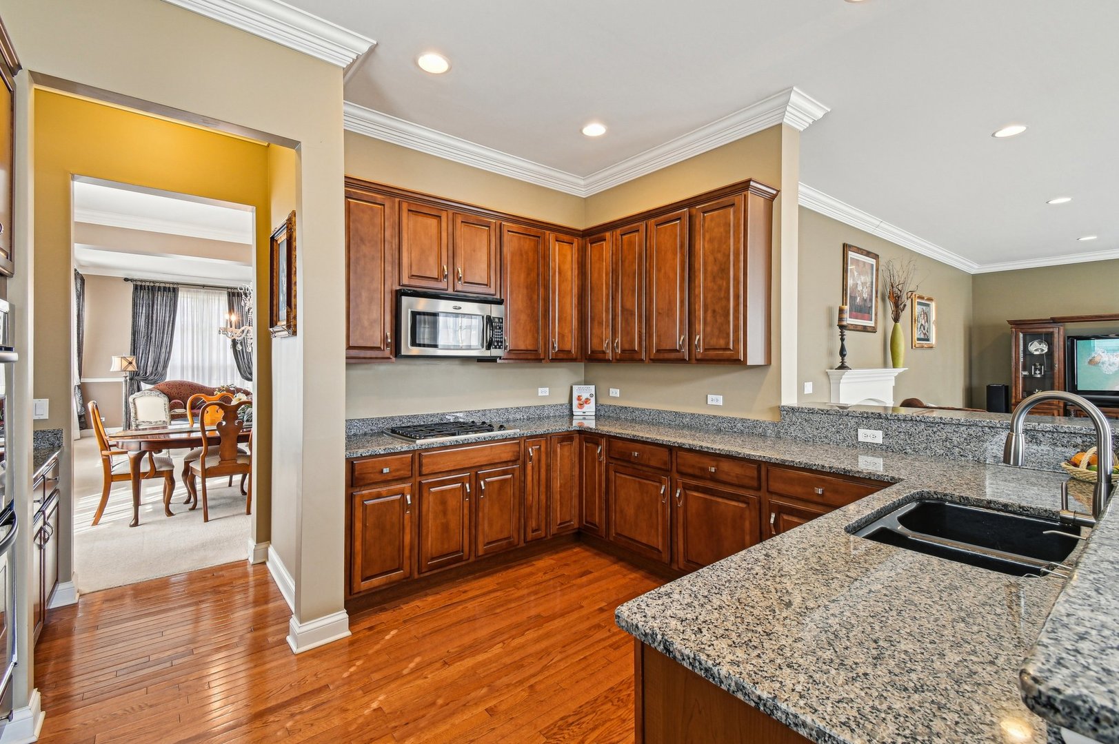 1037 Moray Drive Inverness, IL 60010 - Photo 4 of 50 a kitchen with stainless steel appliances granite countertop a sink stove and cabinets