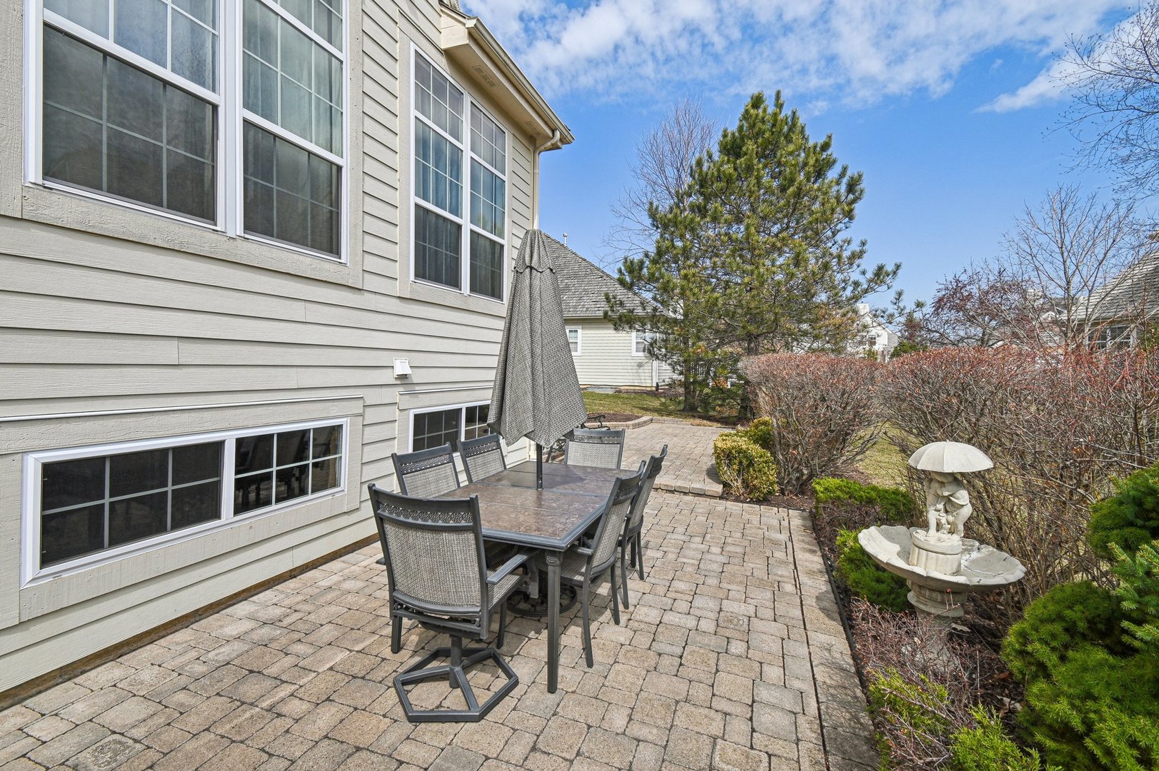 1037 Moray Drive Inverness, IL 60010 - Photo 41 of 50 a view of a patio with table and chairs and potted plants