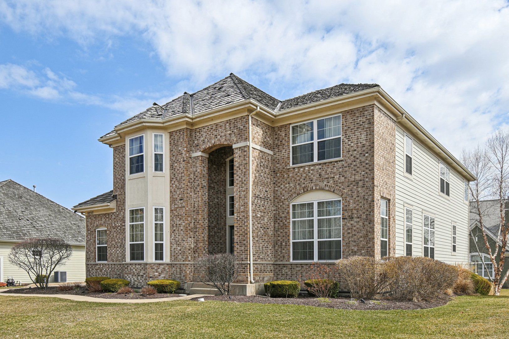 1037 Moray Drive Inverness, IL 60010 - Photo 46 of 50 a front view of a house with a yard