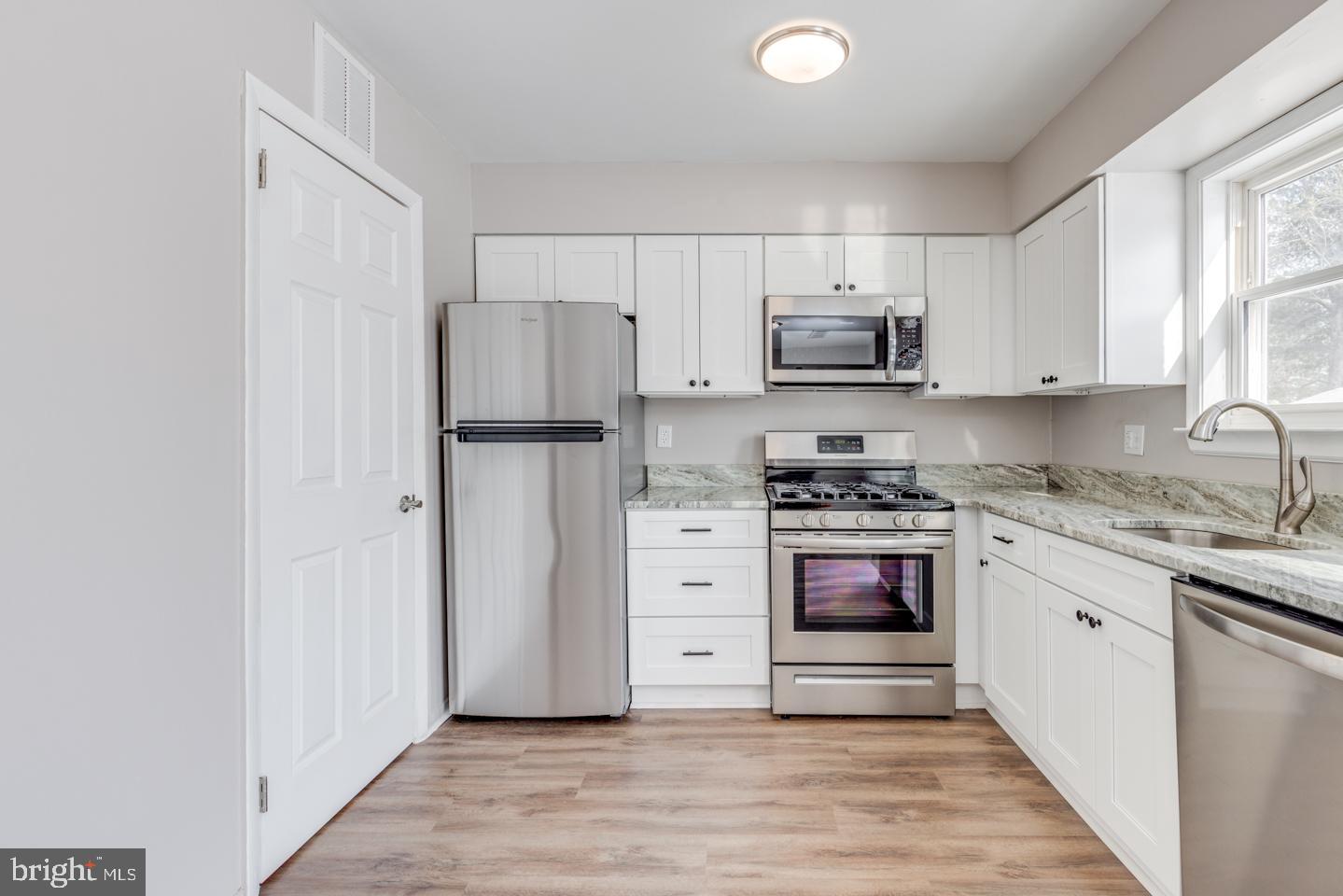 65 Eaves Mill Road Medford, NJ 08055 - Photo 15 of 25 Door to left of refrigerator home to heater & HWH