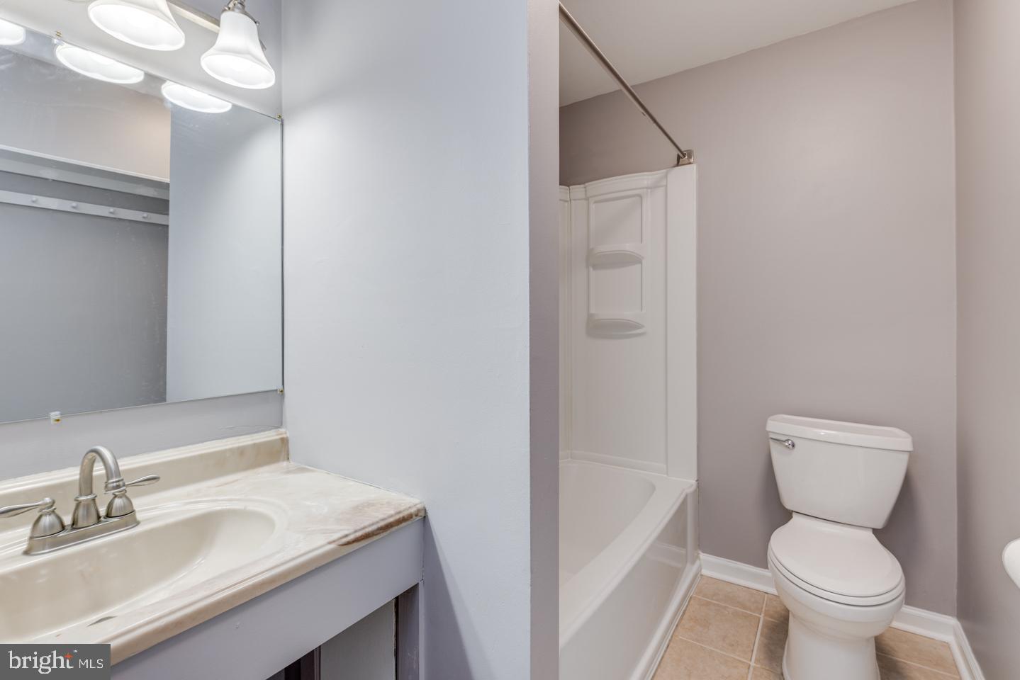 65 Eaves Mill Road Medford, NJ 08055 - Photo 37 of 46 boasts tub with vinyl surround and new light fixtr