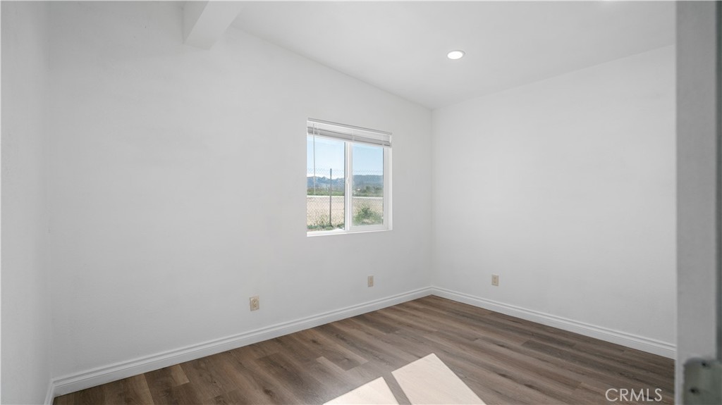 5827 Old Woman Springs Road Johnson Valley, CA 92285 - Photo 11 of 36 an empty room with a window