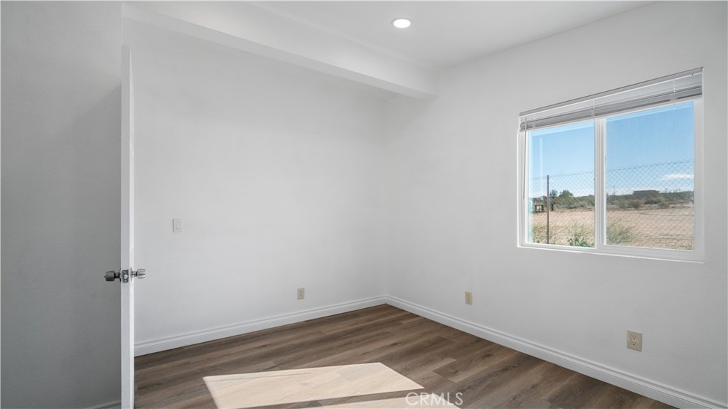 5827 Old Woman Springs Road Johnson Valley, CA 92285 - Photo 13 of 36 an empty room with a window