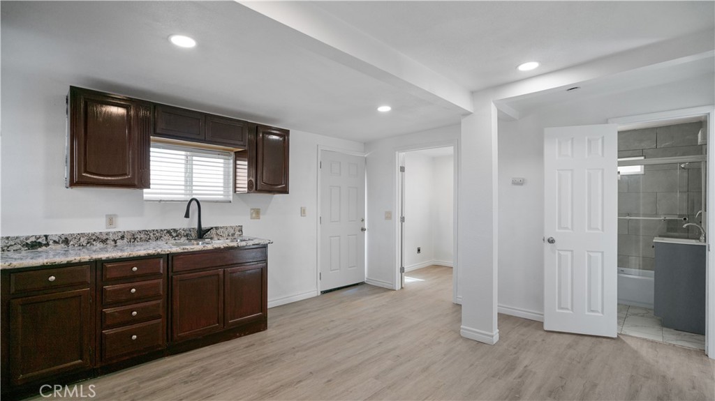 5827 Old Woman Springs Road Johnson Valley, CA 92285 - Photo 14 of 36 a view of a kitchen with a sink and a refrigerator