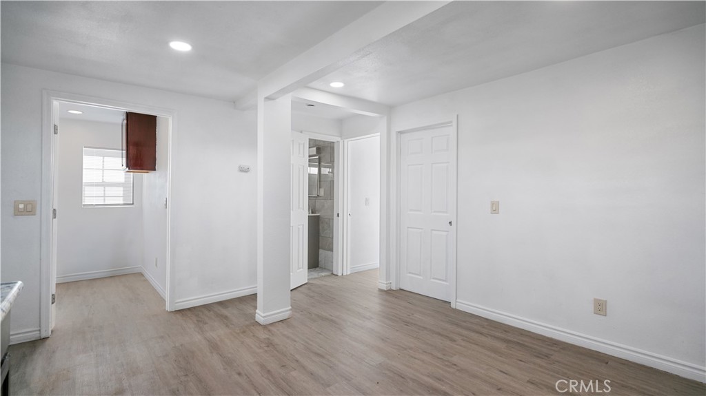 5827 Old Woman Springs Road Johnson Valley, CA 92285 - Photo 15 of 36 a view of an empty room with wooden floor