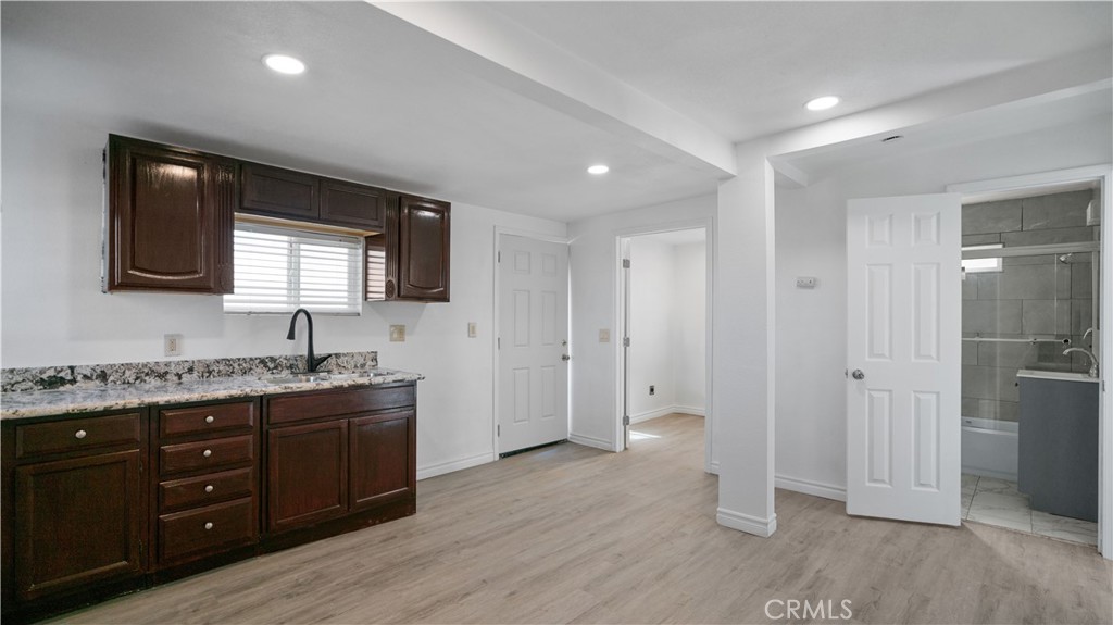 5827 Old Woman Springs Road Johnson Valley, CA 92285 - Photo 17 of 36 a bathroom with a double vanity sink a mirror and a shower