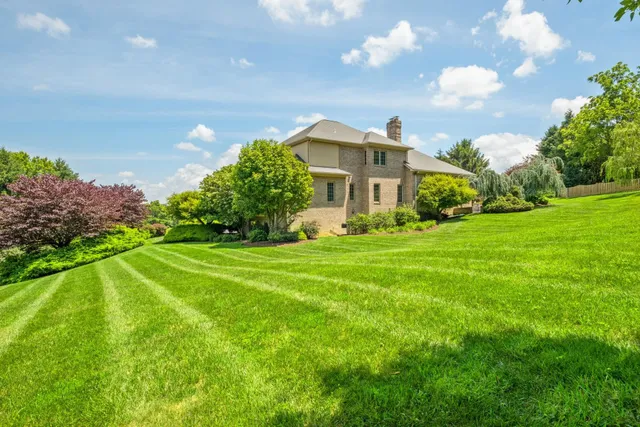a view of staircase with wooden floor and a large window