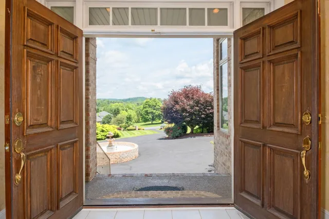 a kitchen with a stove a sink a counter top space and cabinets