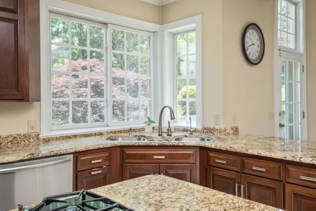 a view of an empty room with a fireplace