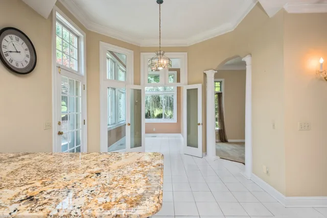a view of a dining room with furniture window and outside view