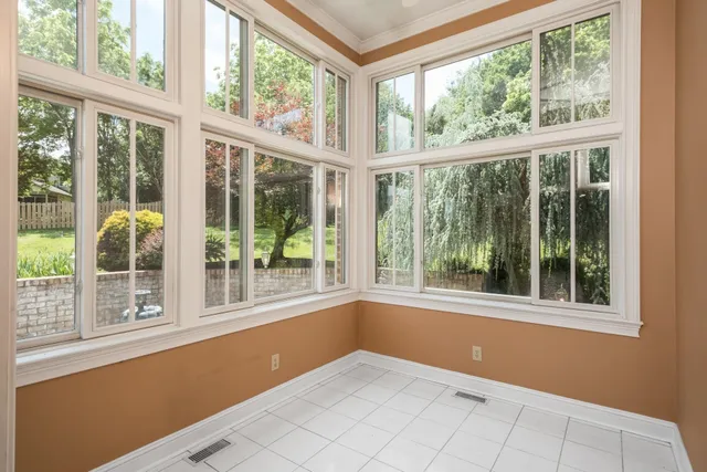 a view of a chandelier fan and wooden floor