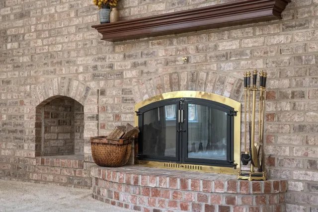 a view of hallway with furniture and a window