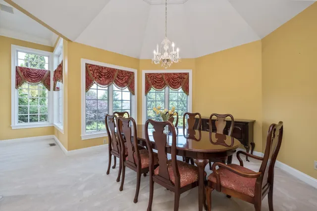 a view of staircase with railing and white walls