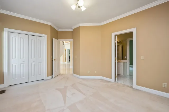 a white bath tub sitting in a bathroom next to a window