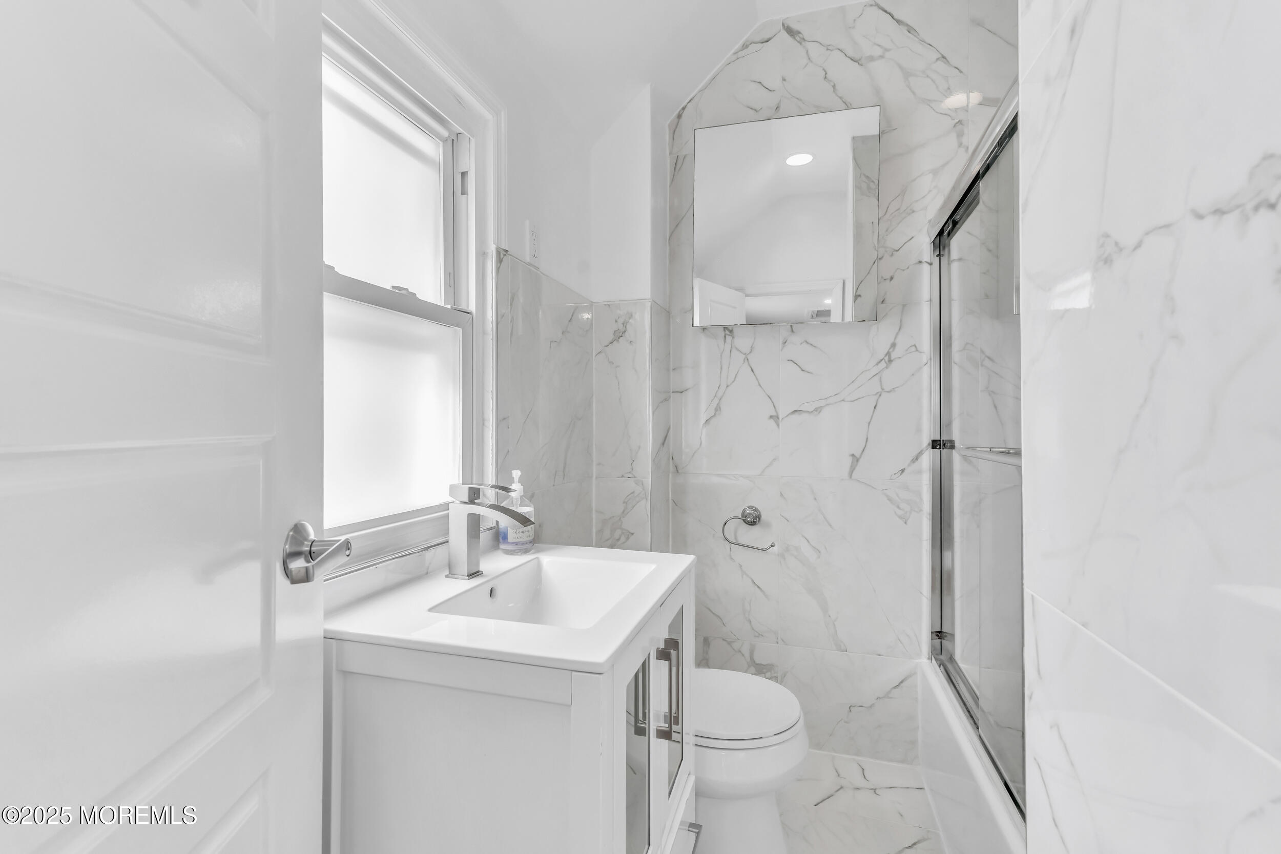 323 Roosevelt Avenue Oakhurst, NJ 07755 - Photo 12 of 19 a bathroom with a sink toilet and shower