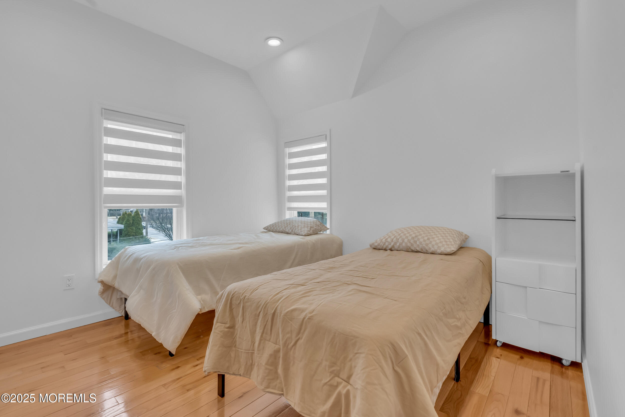 323 Roosevelt Avenue Oakhurst, NJ 07755 - Photo 14 of 19 a bedroom with two beds and a window