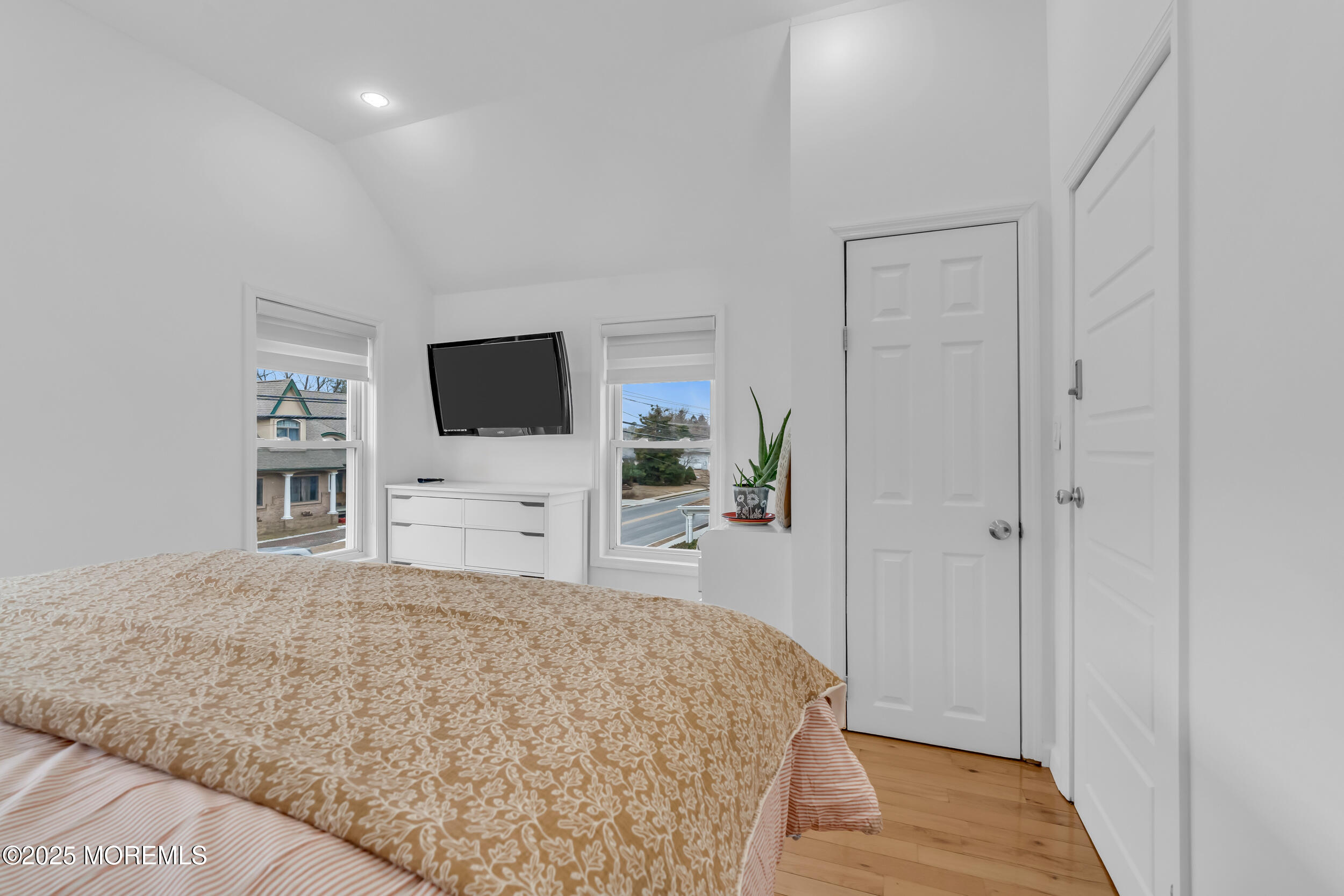 323 Roosevelt Avenue Oakhurst, NJ 07755 - Photo 15 of 19 a bedroom with a bed and a flat screen tv