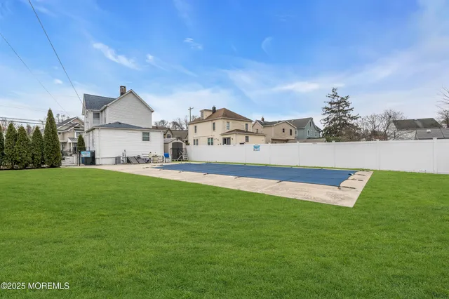 a view of an house with a big yard