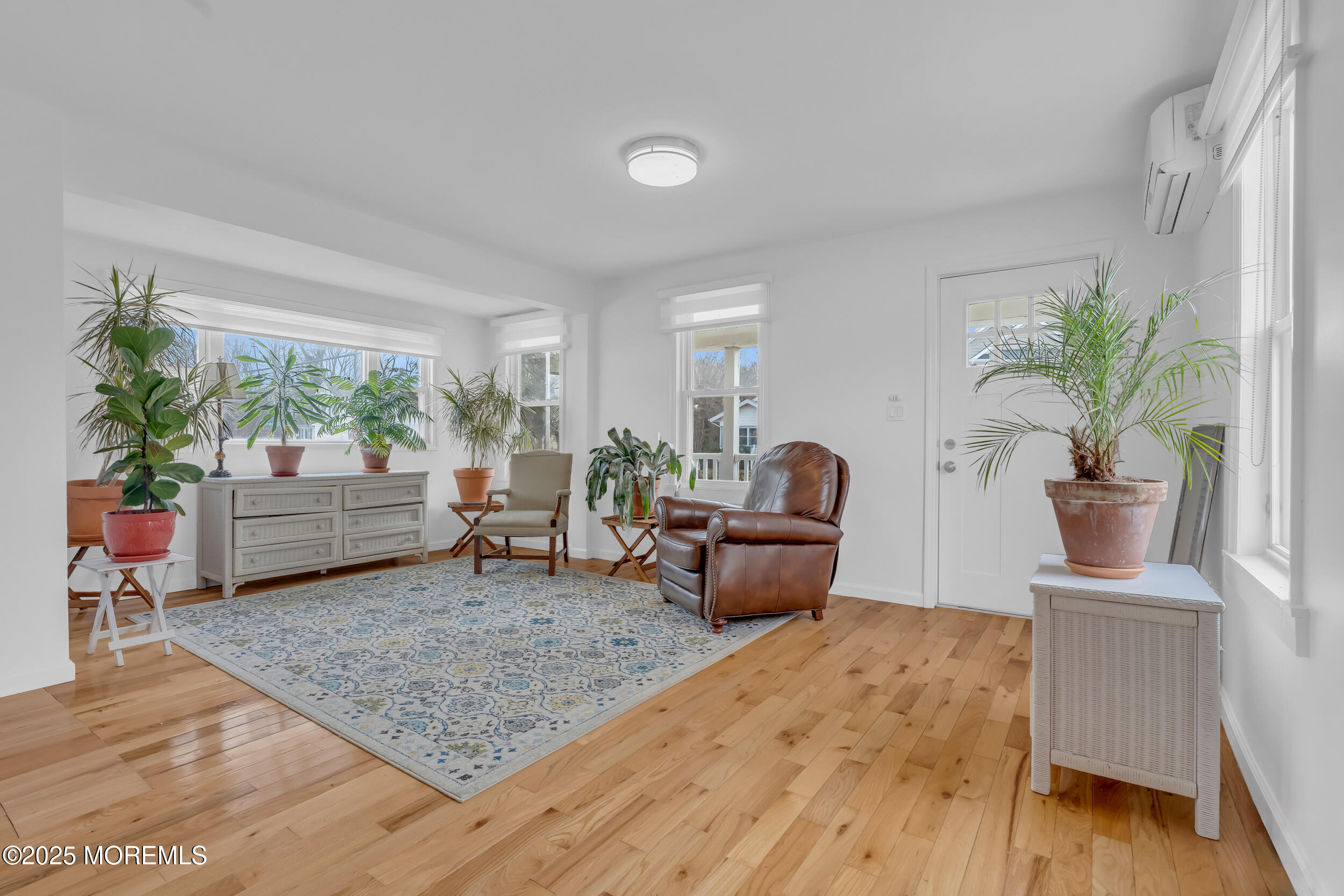 323 Roosevelt Avenue Oakhurst, NJ 07755 - Photo 4 of 19 a living room with furniture and a potted plant