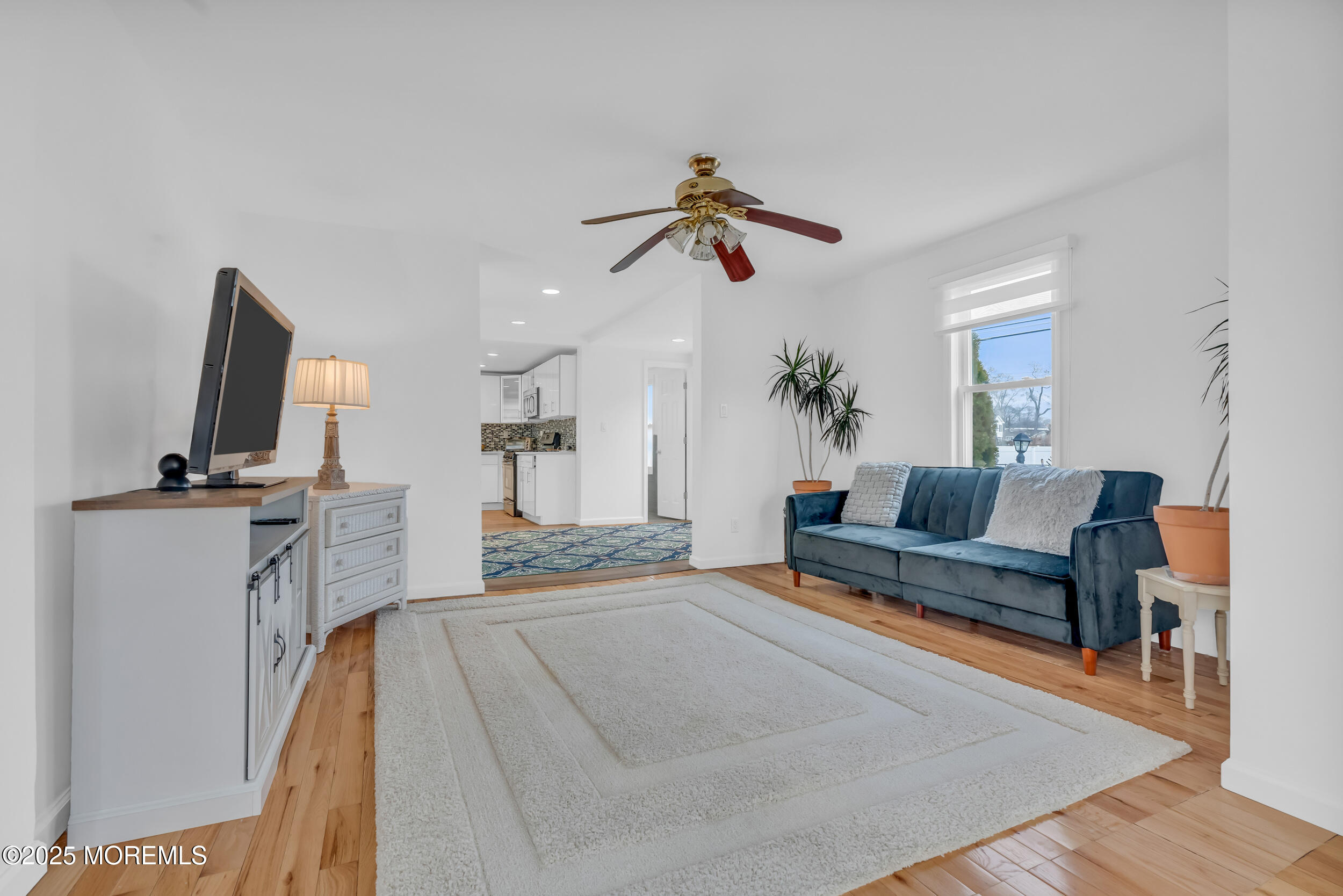 323 Roosevelt Avenue Oakhurst, NJ 07755 - Photo 6 of 19 a living room with furniture and a flat screen tv