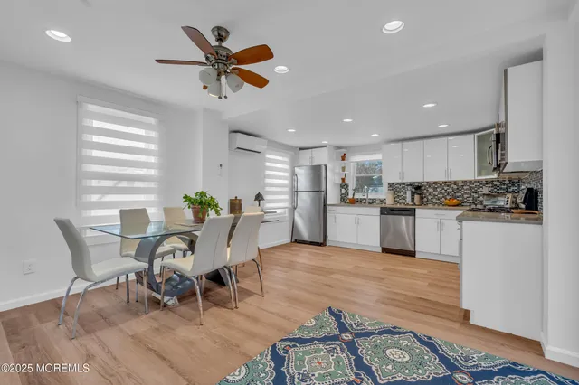 a view of kitchen with cabinets and wooden floor