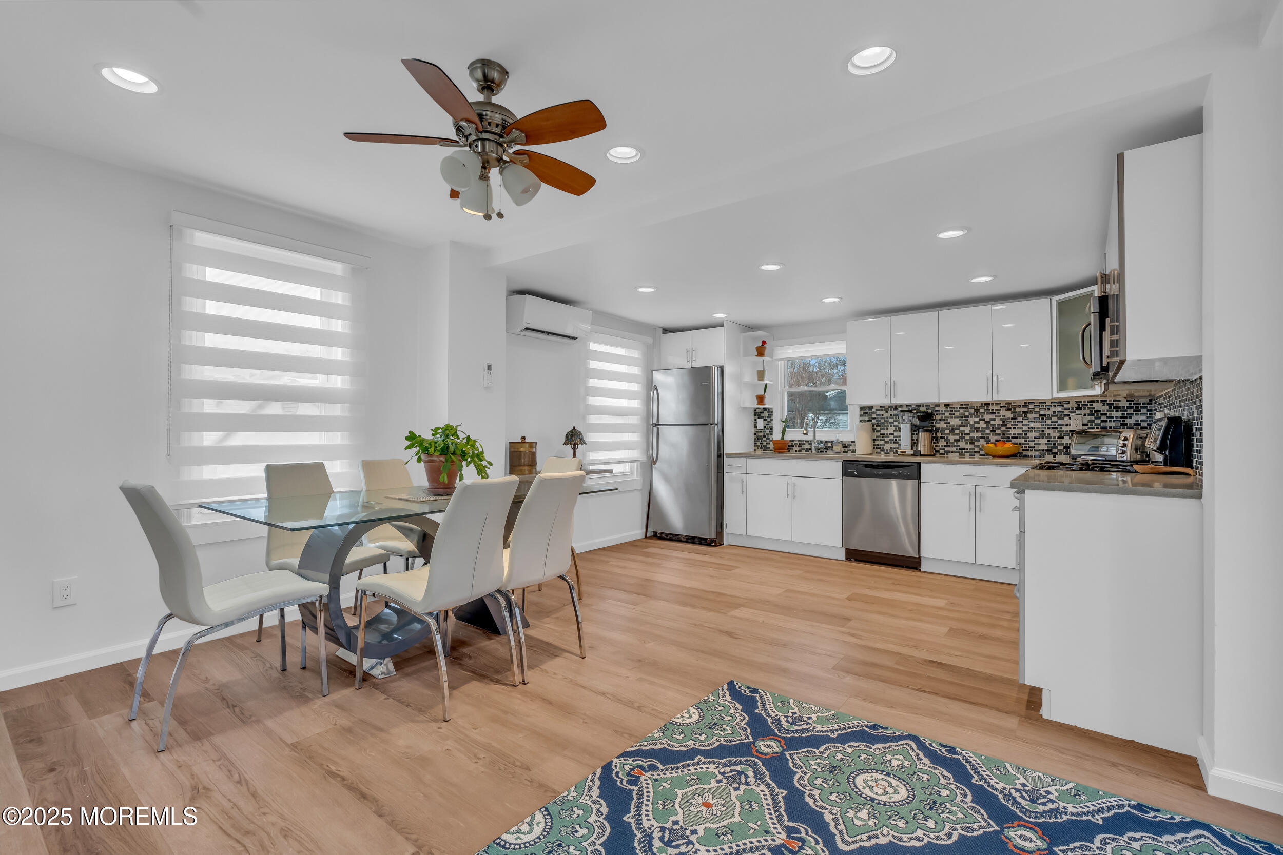 323 Roosevelt Avenue Oakhurst, NJ 07755 - Photo 7 of 19 a view of kitchen with cabinets and wooden floor