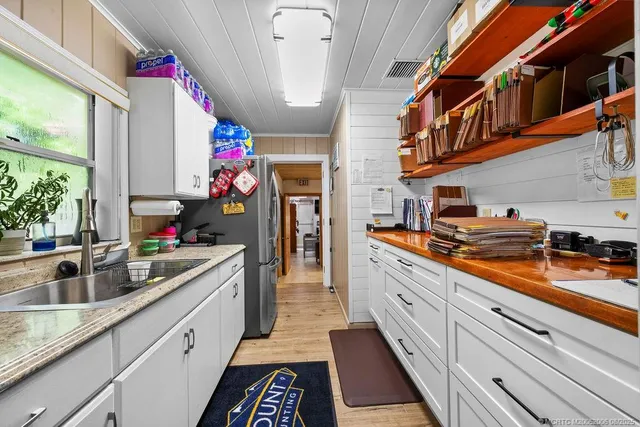 a kitchen with granite countertop lots of counter top space