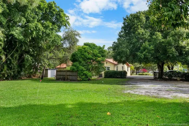 a house view with a sitting space and garden