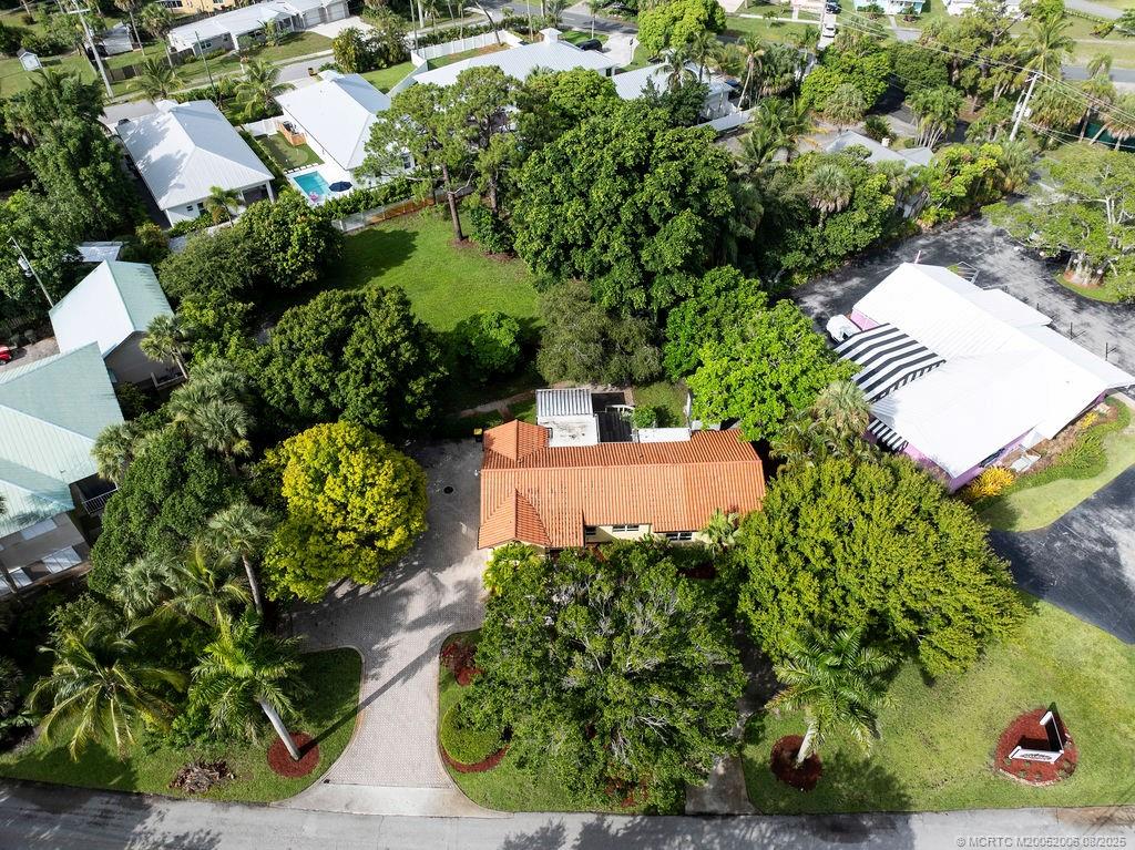 400 Southeast Flamingo Avenue Stuart, FL 34996 - Photo 4 of 33 an aerial view of a house with a yard and garden