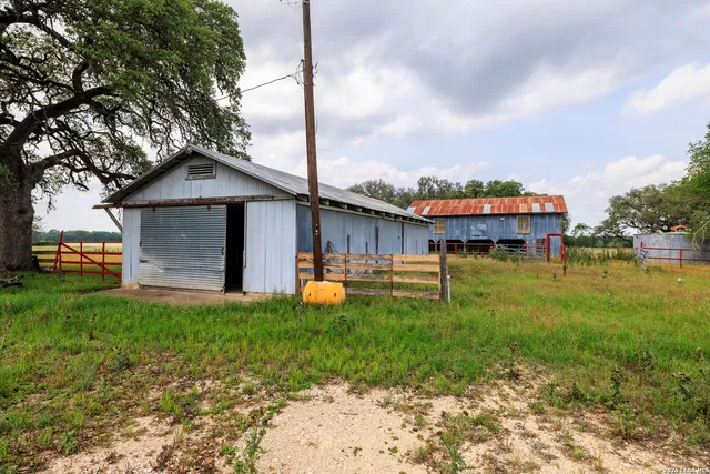 a front view of house with yard and trees