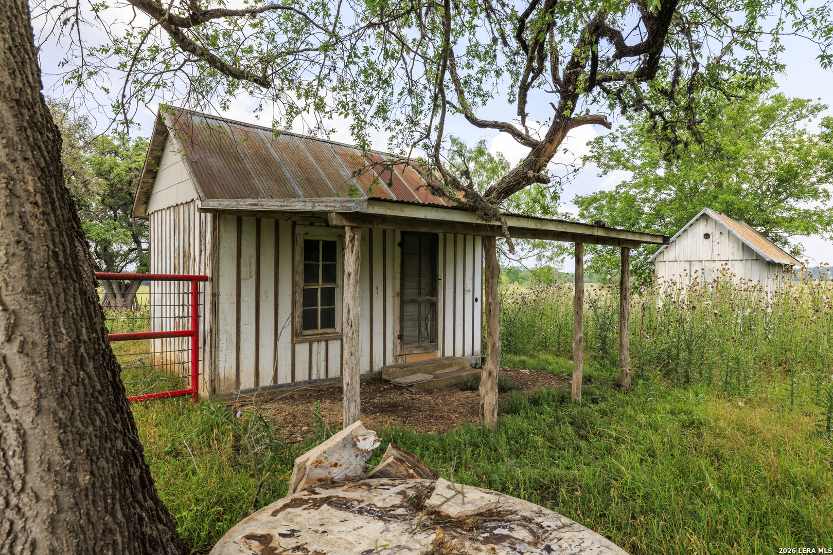 0 Comfort River Ranch Comfort, TX 78013 - Photo 22 of 23 a view of a house with a small yard plants and large tree