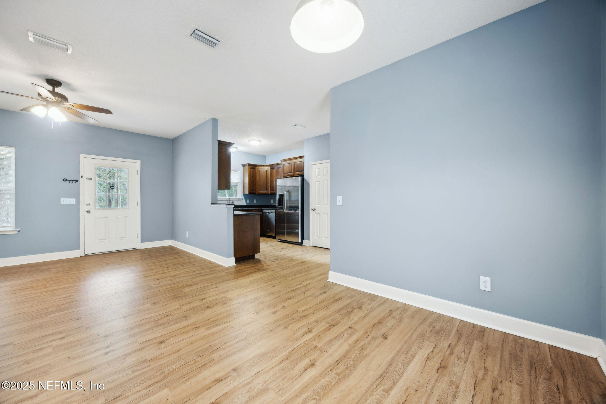 85484 Miner Road Yulee, FL 32097 - Photo 13 of 38 a view of empty room with wooden floor