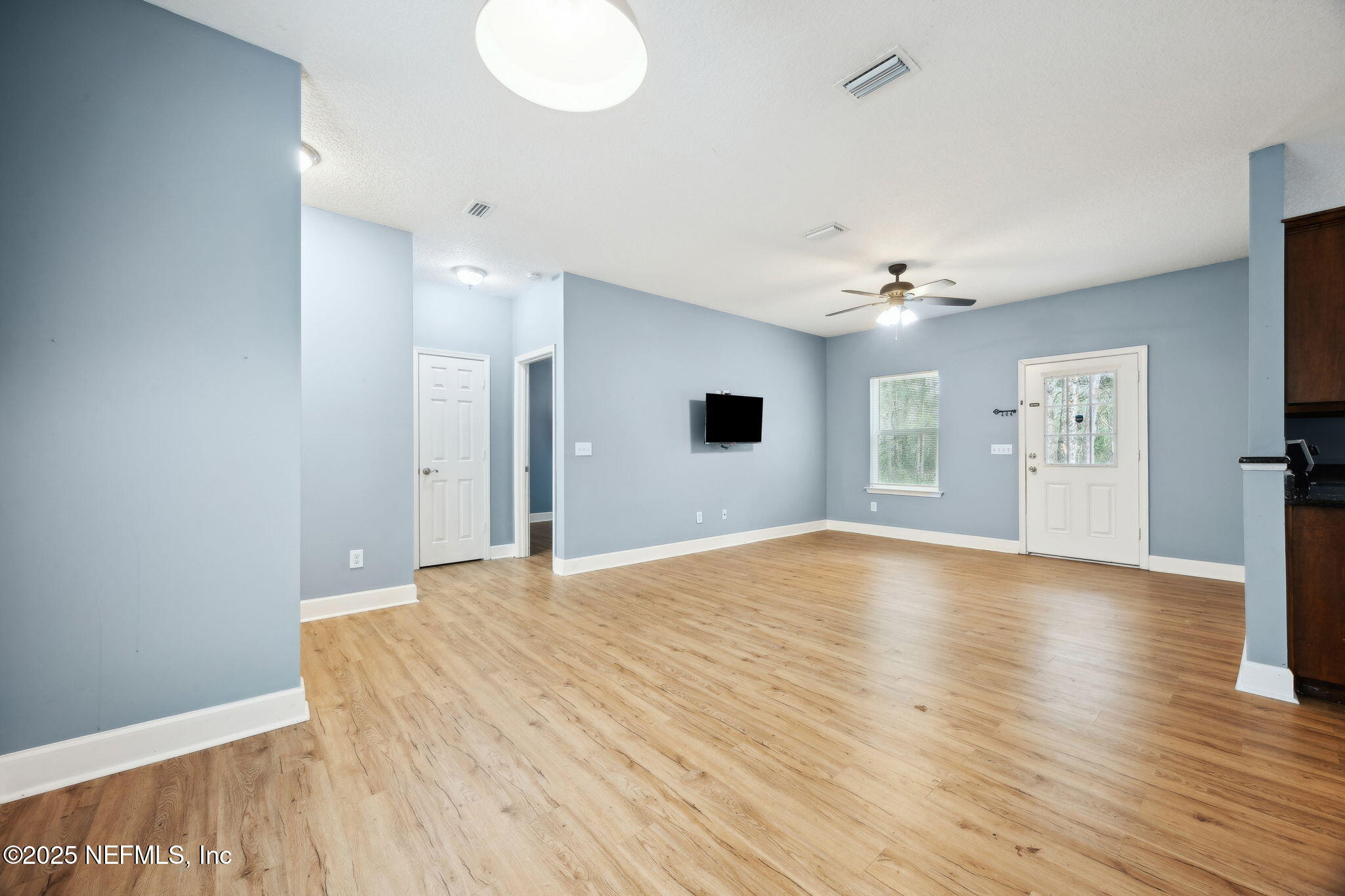 85484 Miner Road Yulee, FL 32097 - Photo 14 of 38 a view of empty room with wooden floor