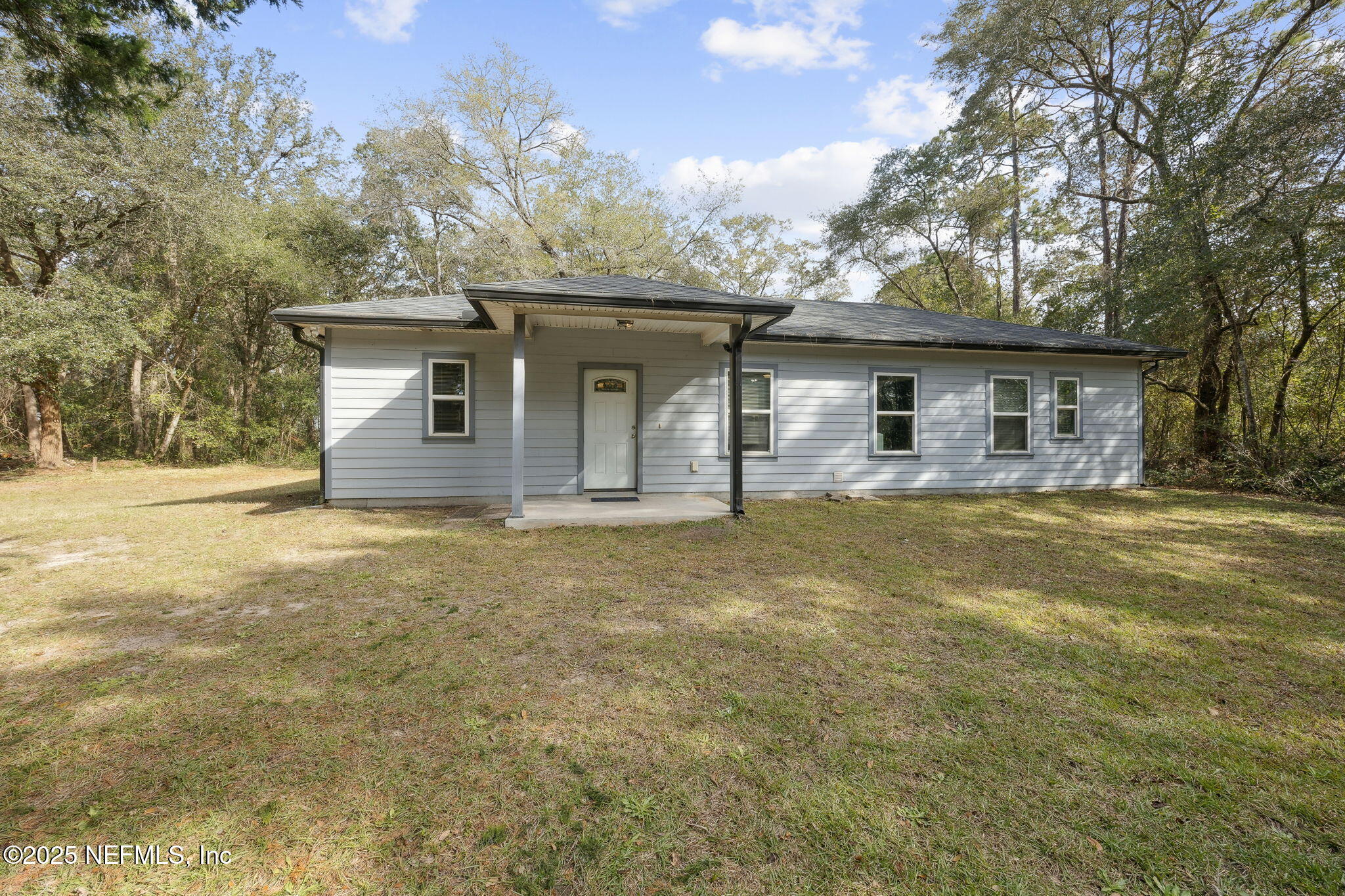 85484 Miner Road Yulee, FL 32097 - Photo 2 of 38 a house with trees in the background