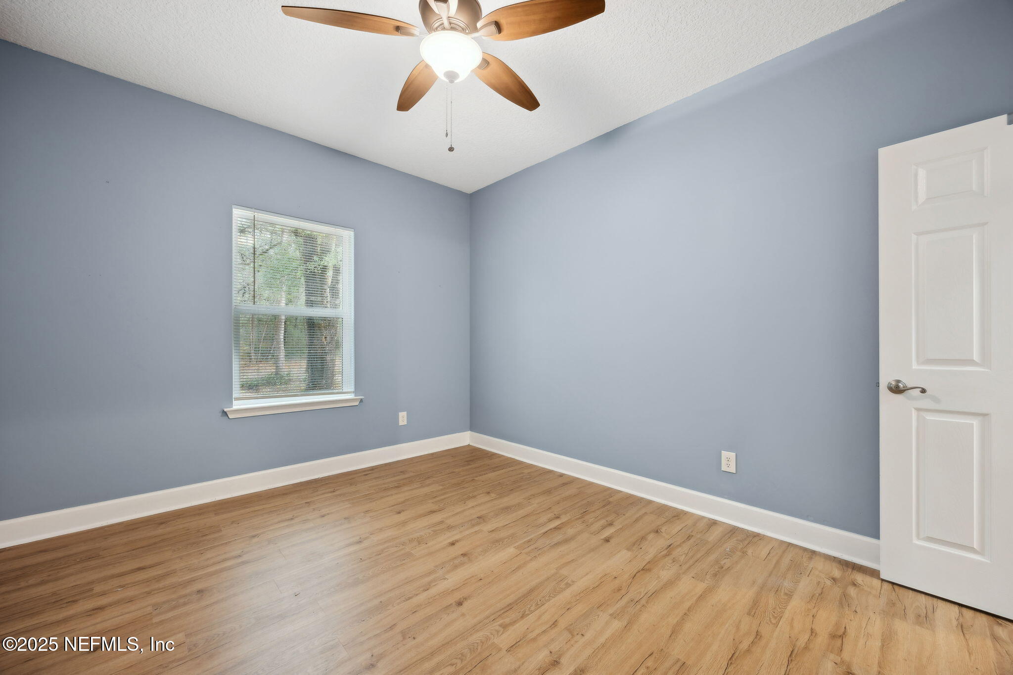 85484 Miner Road Yulee, FL 32097 - Photo 27 of 38 wooden floor in an empty room with a window