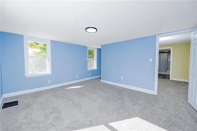 an empty room with windows