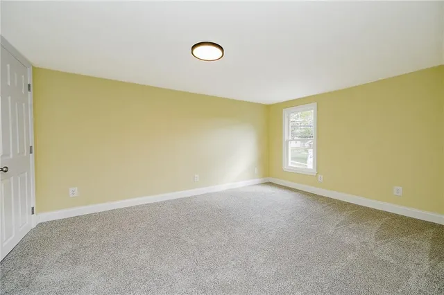 a view of a big room with windows