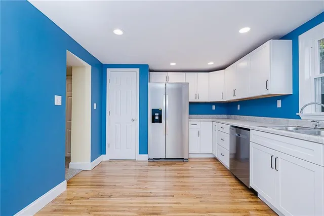a view of a kitchen with electric appliances