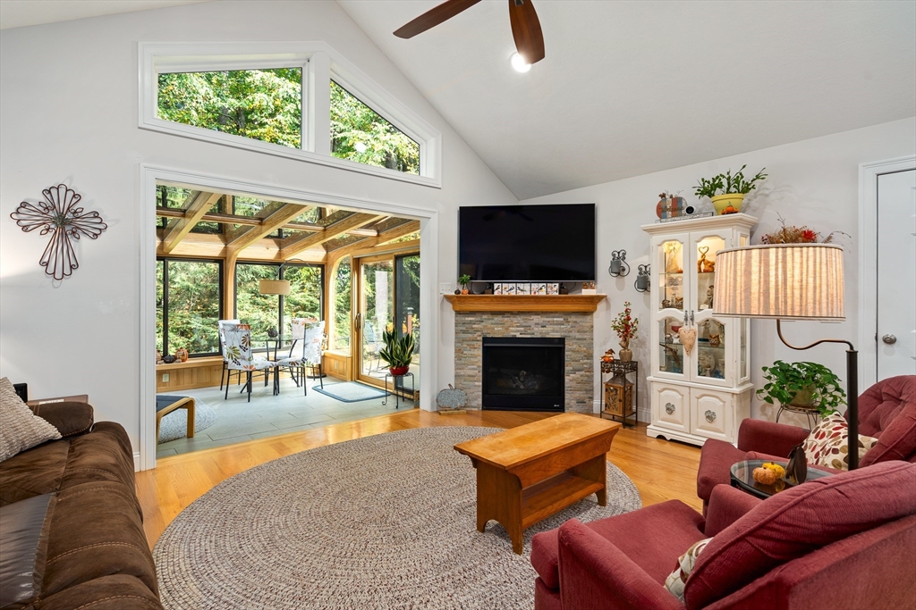 25 Paul Street Easthampton, MA 01027 - Photo 11 of 42 a living room with furniture a flat screen tv and a fireplace