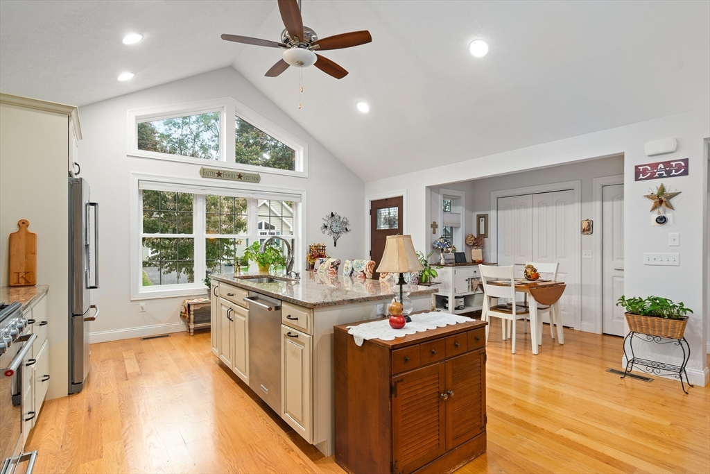 25 Paul Street Easthampton, MA 01027 - Photo 16 of 42 a very nice looking living room with a large window a dining table and chairs with wooden floor