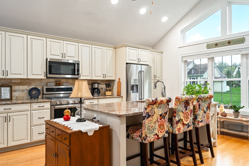 25 Paul Street Easthampton, MA 01027 - Photo 18 of 42 a kitchen with stainless steel appliances a stove refrigerator sink and cabinets
