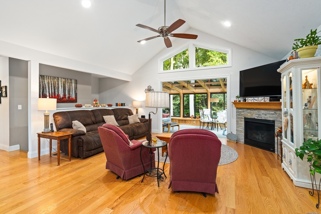 25 Paul Street Easthampton, MA 01027 - Photo 19 of 42 a living room with furniture a fireplace and a flat screen tv