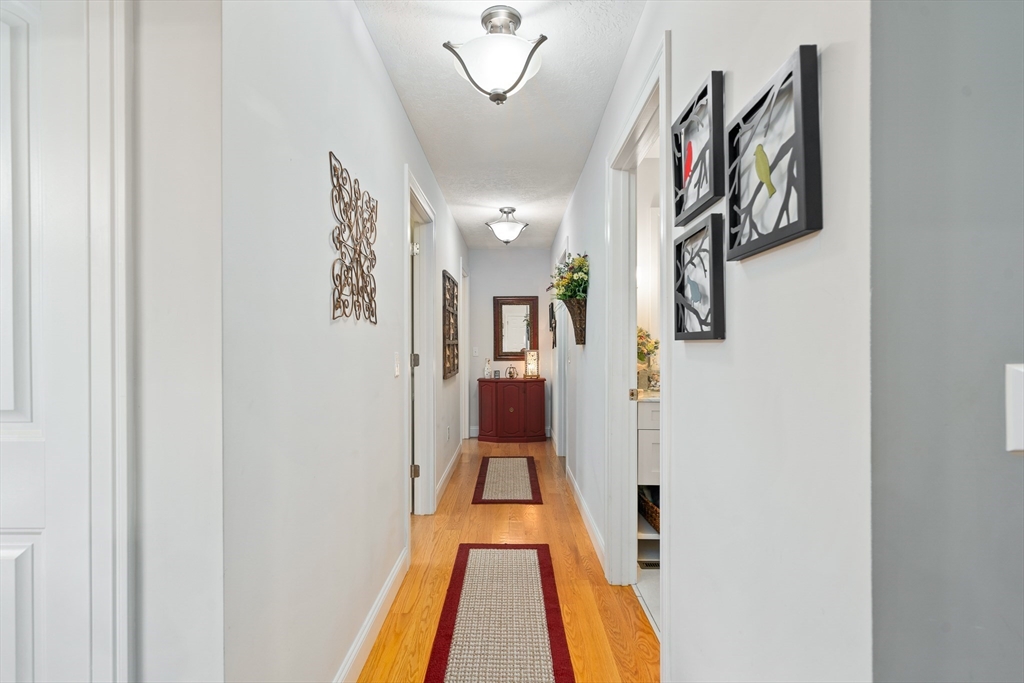 25 Paul Street Easthampton, MA 01027 - Photo 33 of 42 a view of a hallway with paintings on the wall