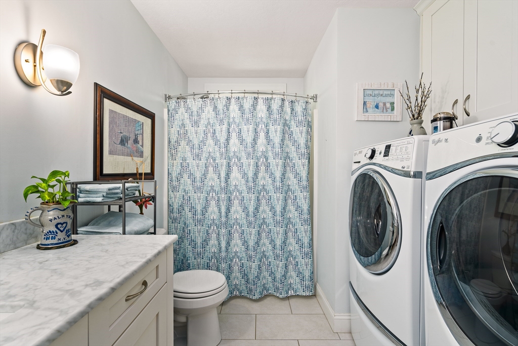 25 Paul Street Easthampton, MA 01027 - Photo 36 of 42 a bathroom with a toilet sink and mirror